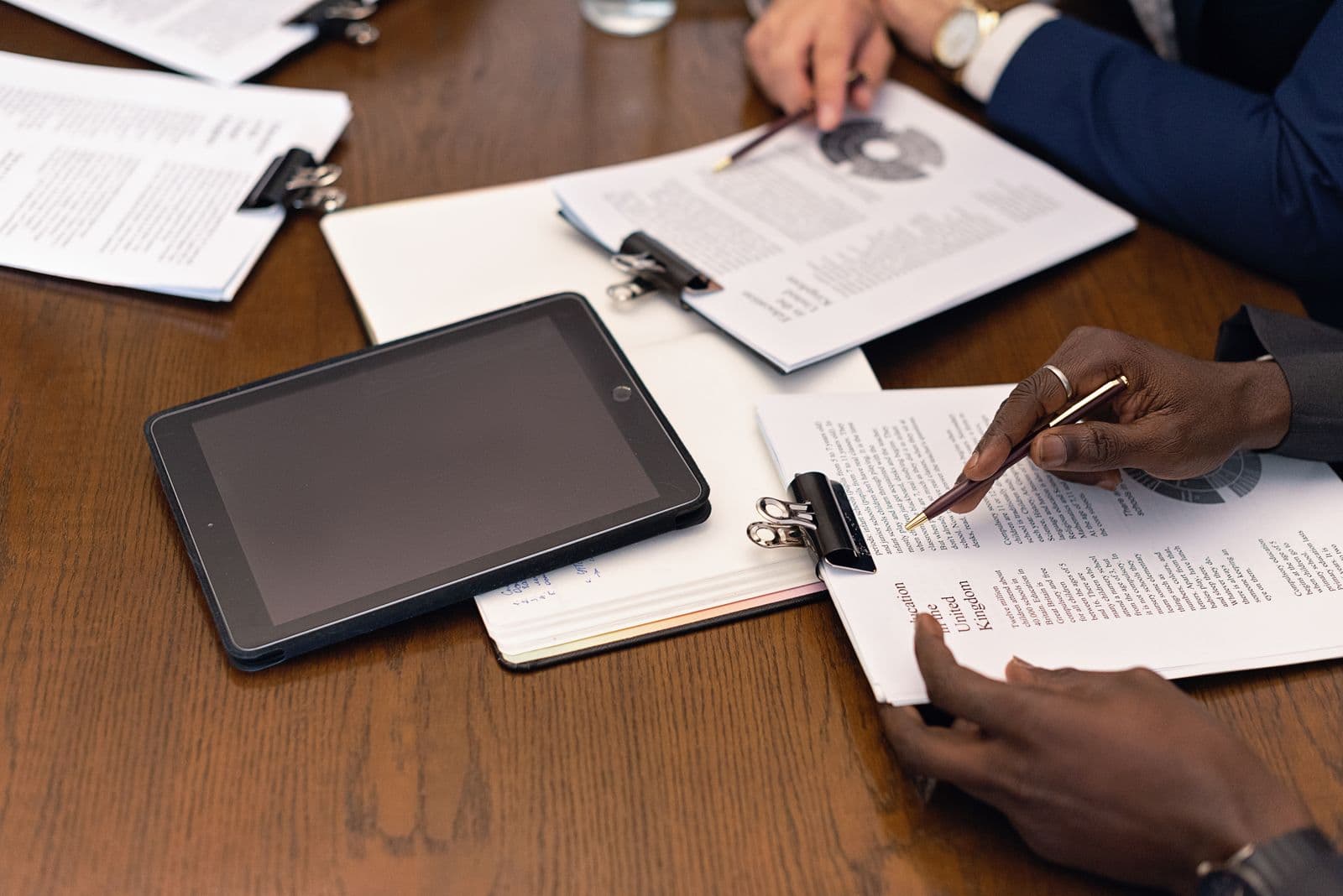 Team reviewing confidential documents during a virtual data room workflow