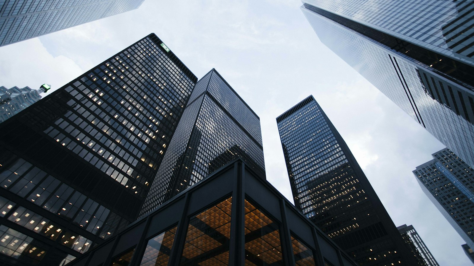 Corporate office skyscraper representing institutional transaction closing and archive