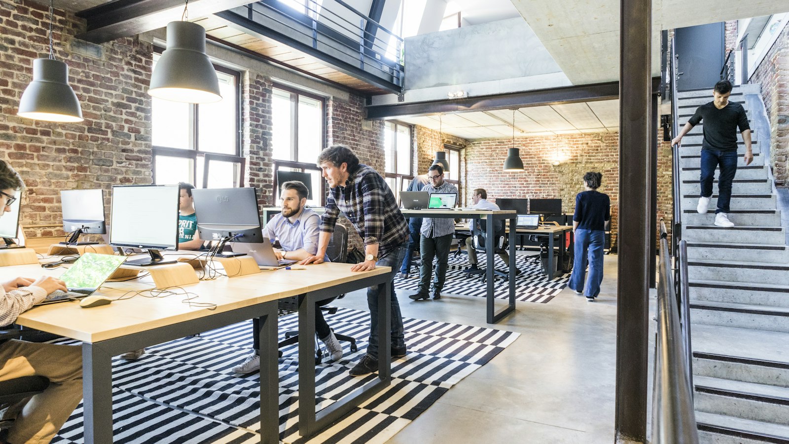 Startup founders presenting pitch presentation to venture capital investors