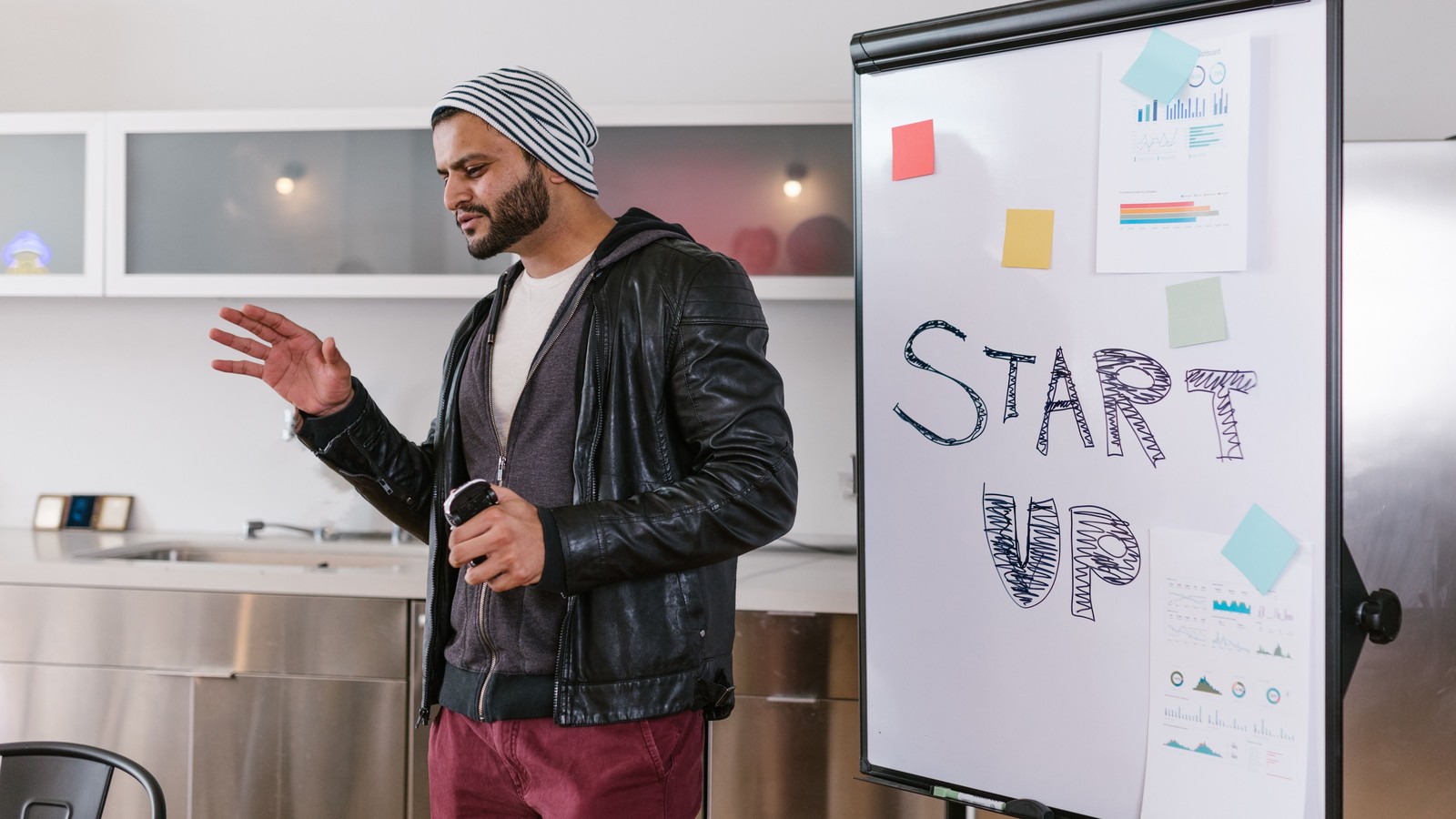 Founder presenting business information to colleagues