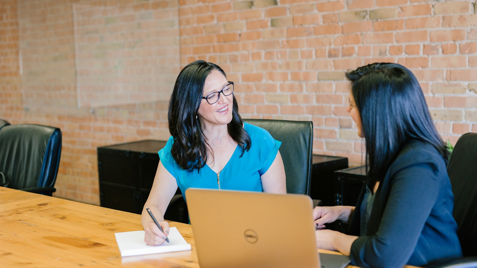 Advisor presenting secure client portal documentation to client