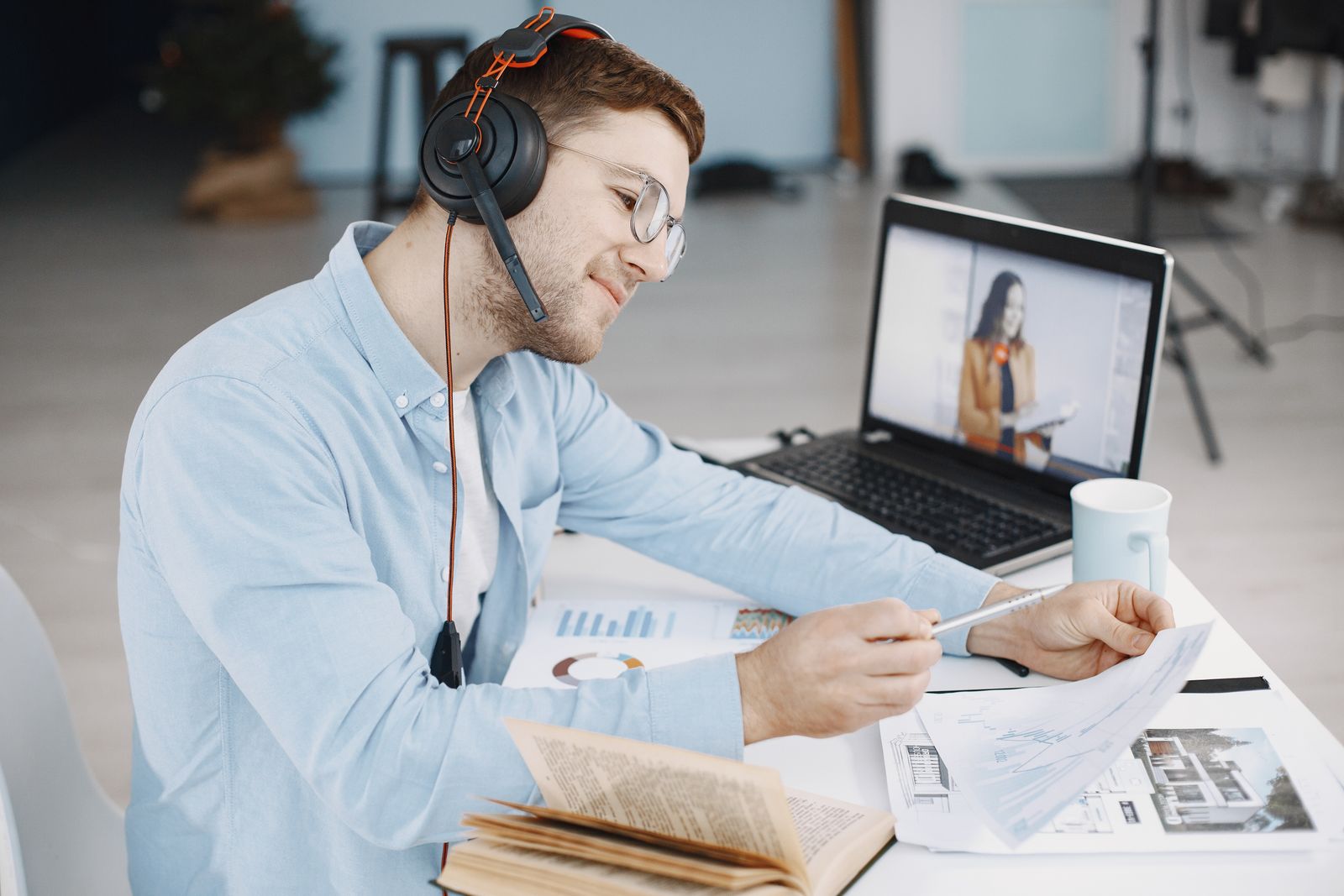 Professional working with documents and headphones