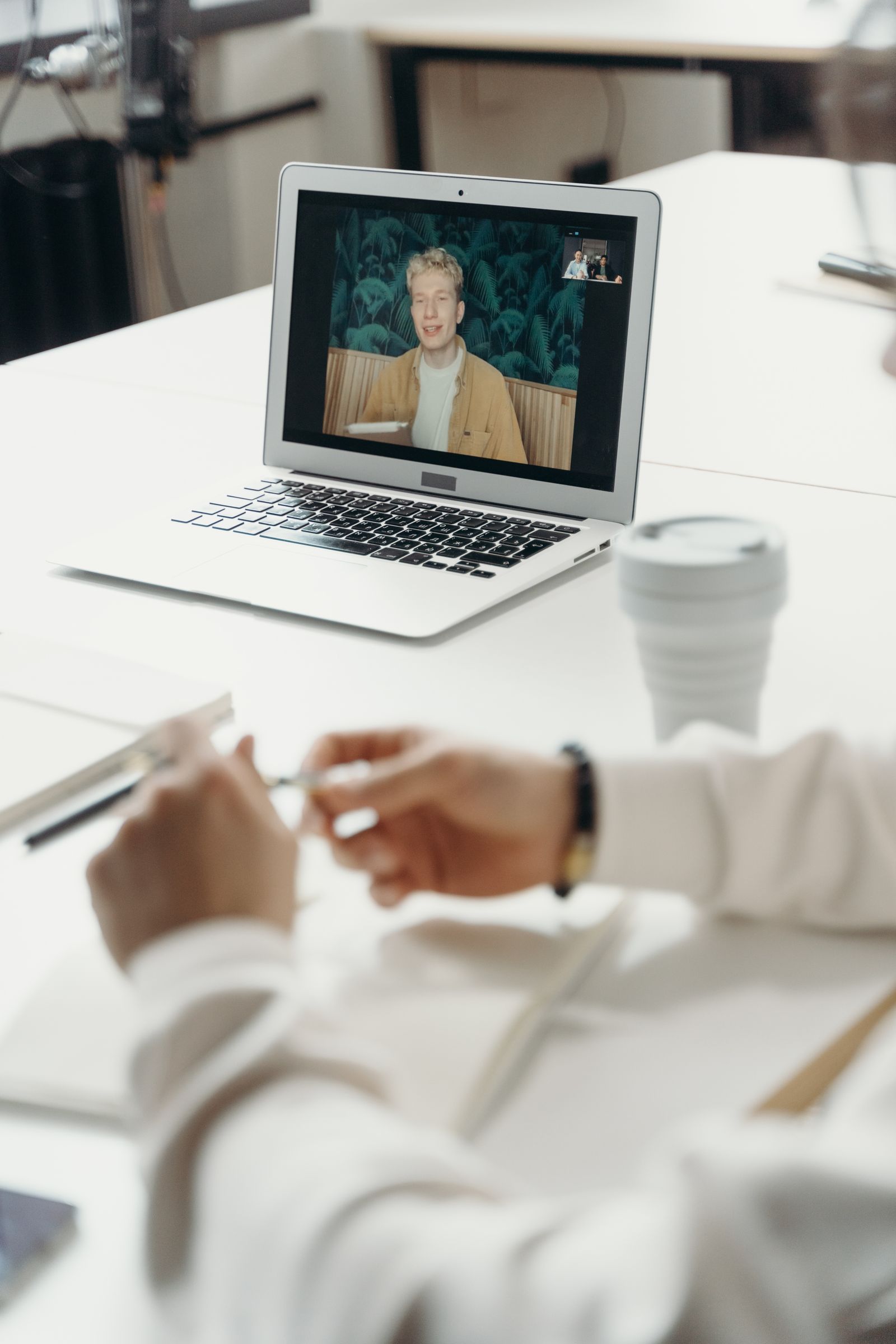 Laptop showing a participant in a video meeting