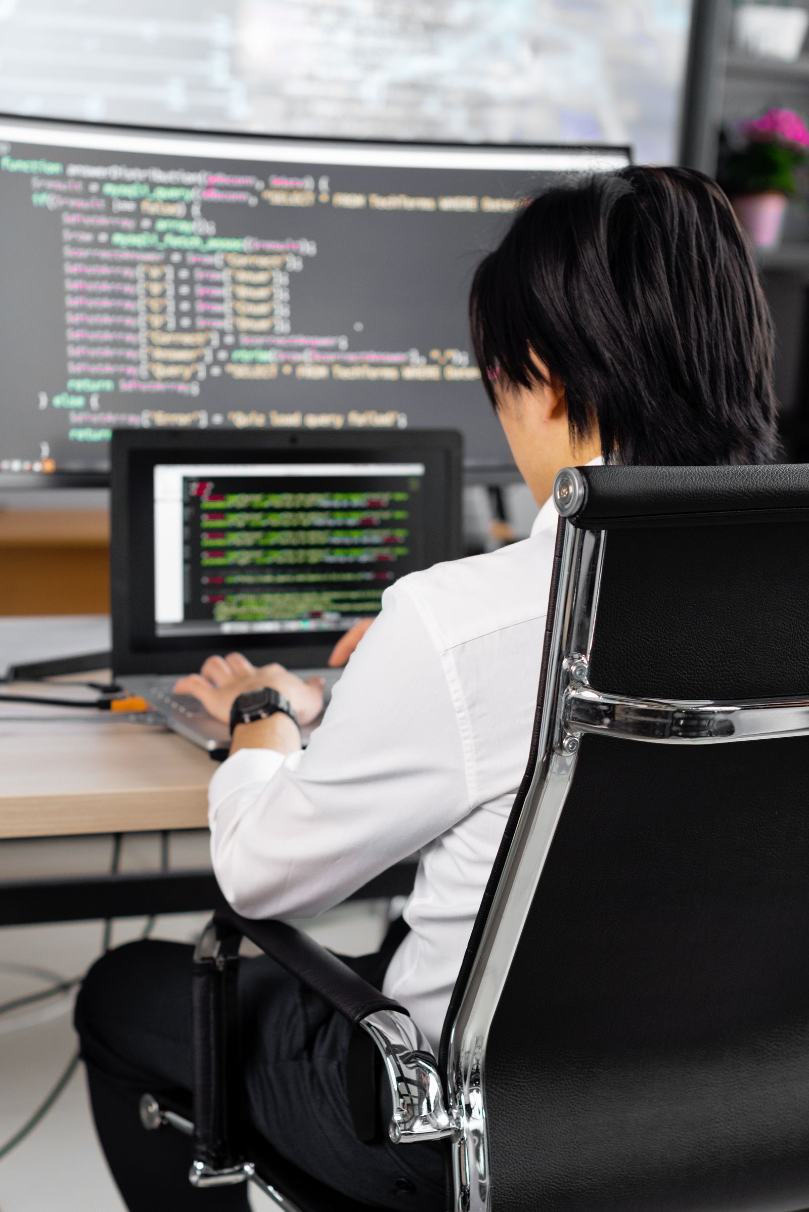 Software professional working at a laptop