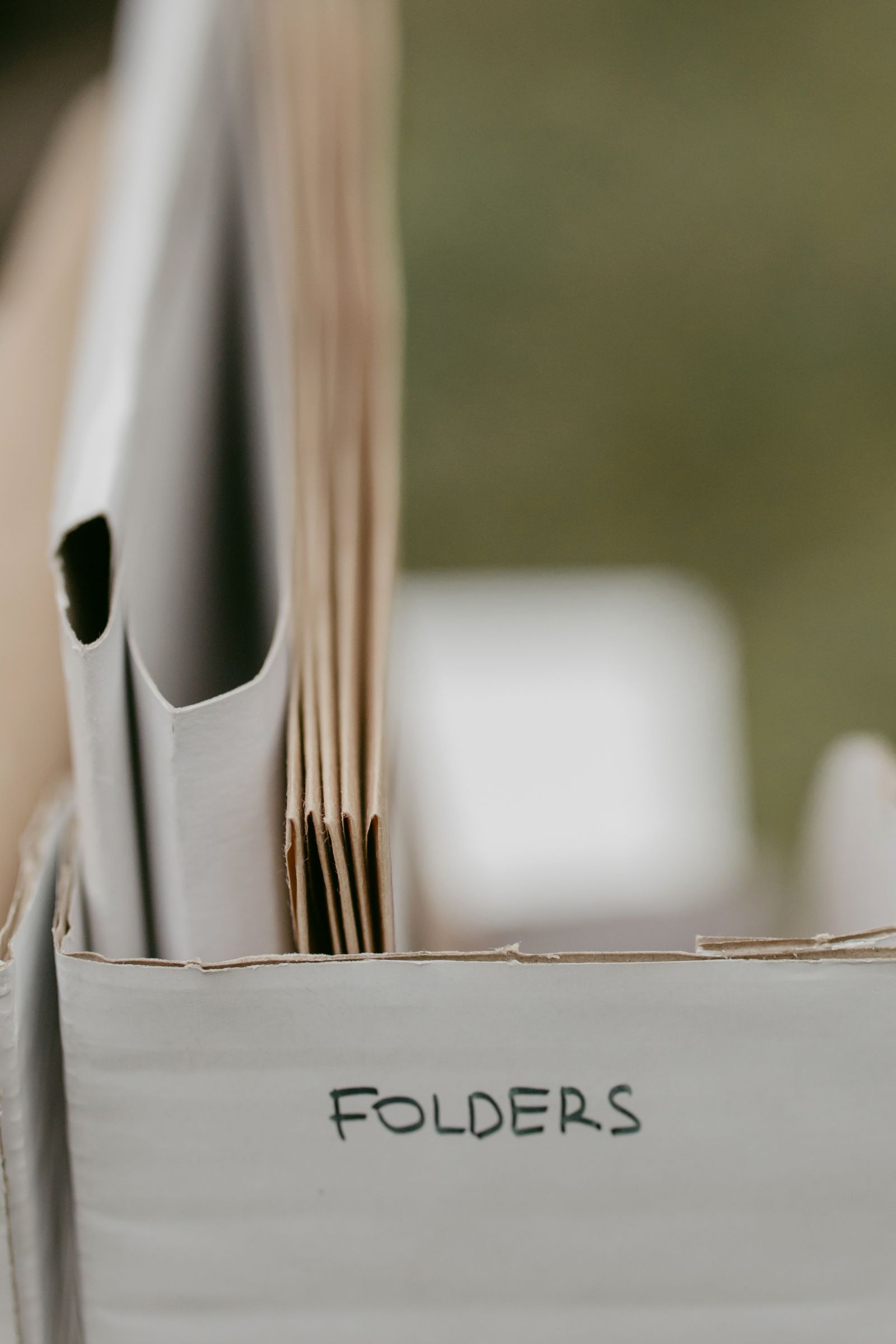Labeled folders organized in a box
