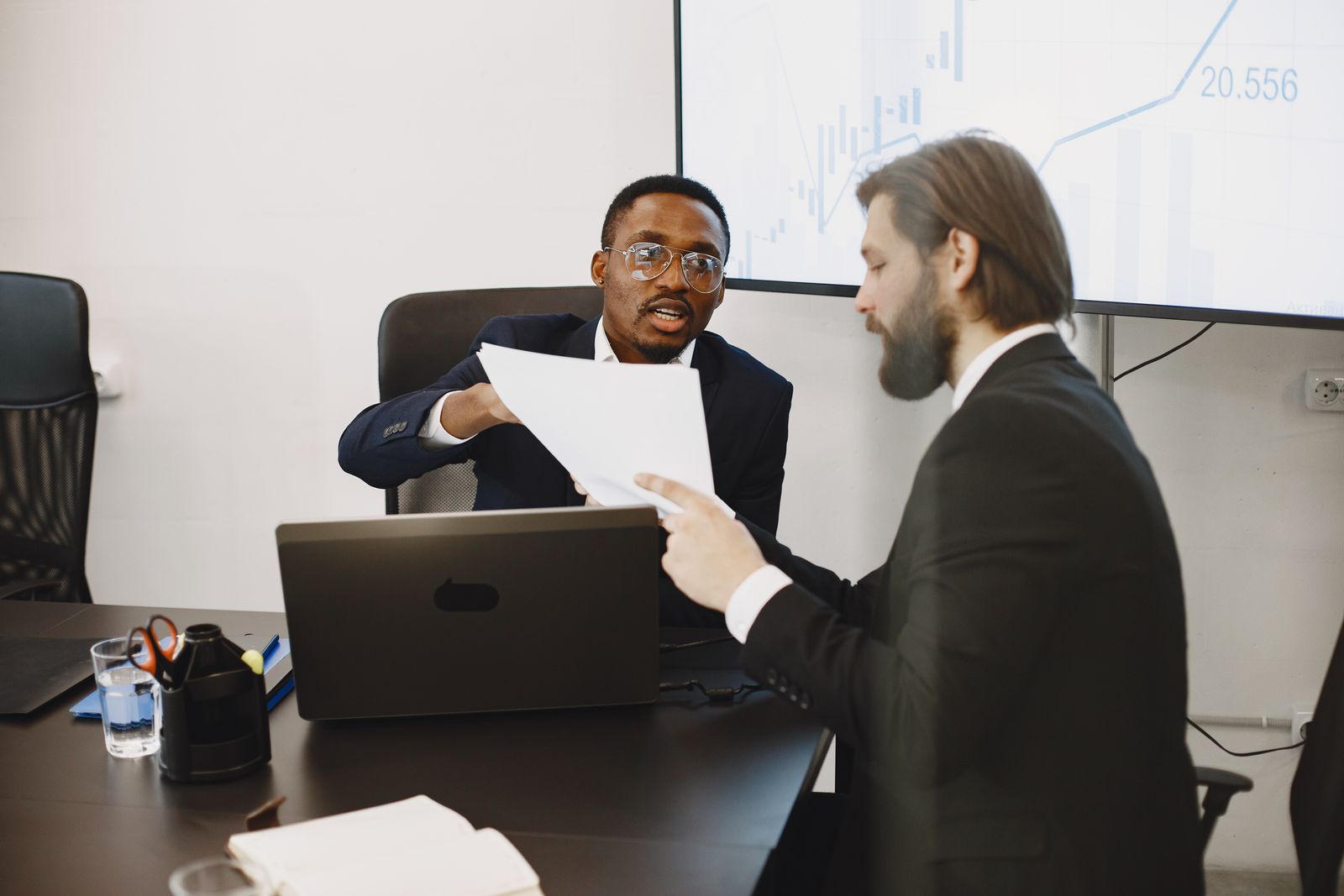 Colleagues discussing business documents