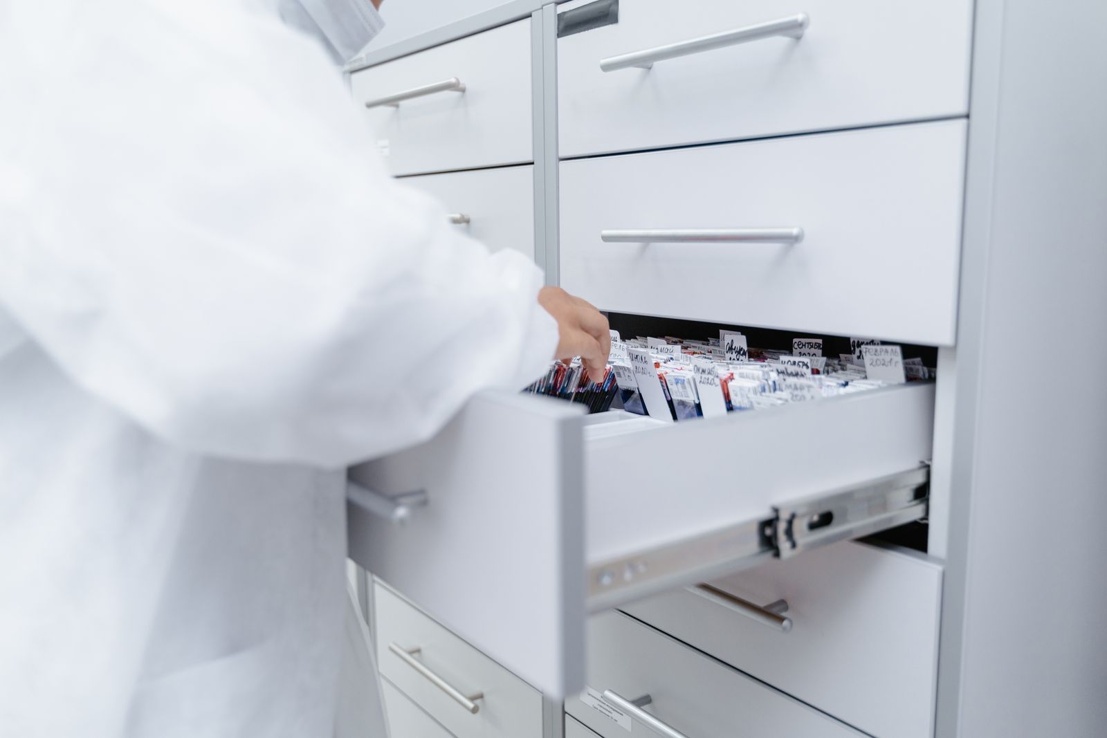 Healthcare professional reviewing medical files