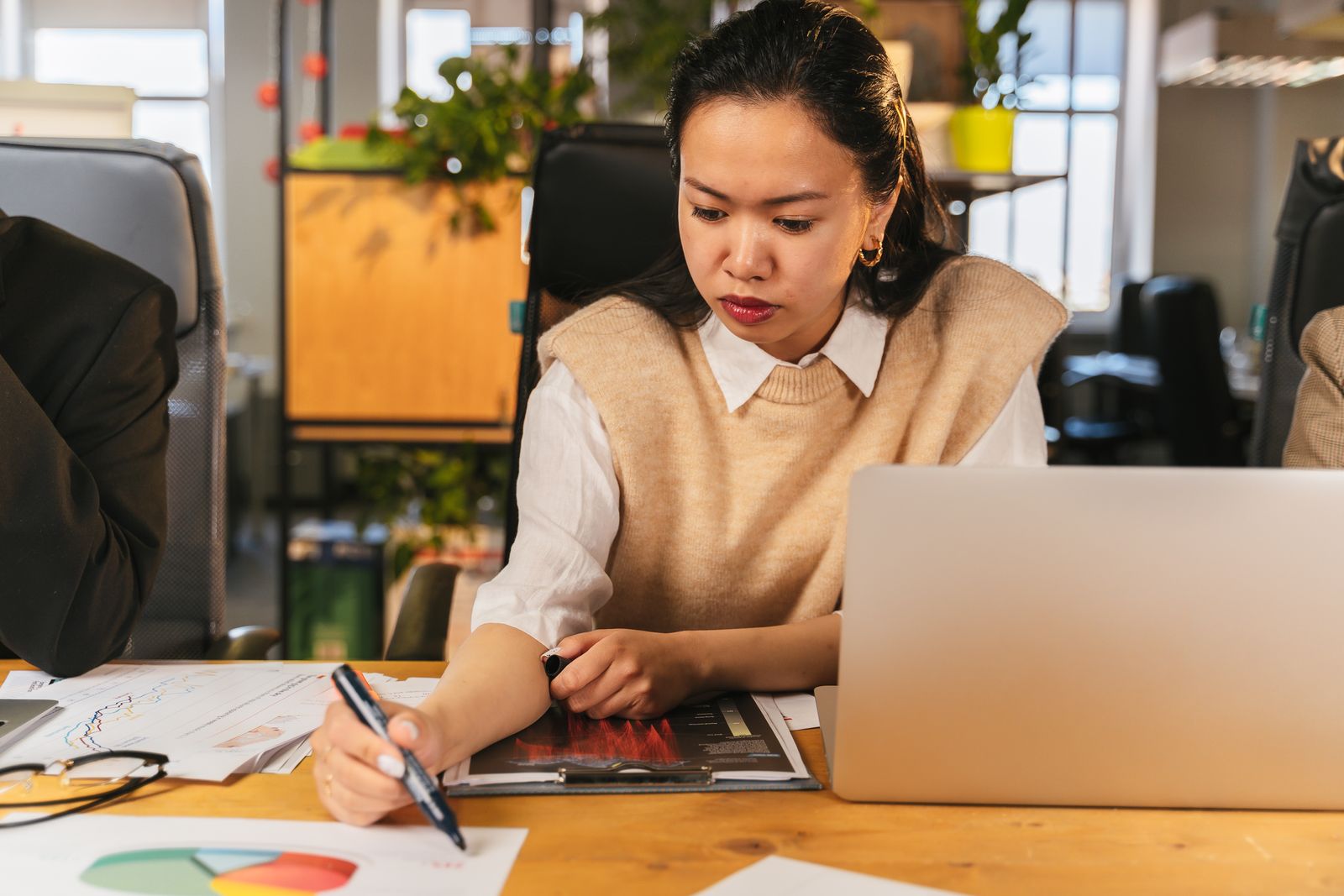 Woman reviewing charts in an office