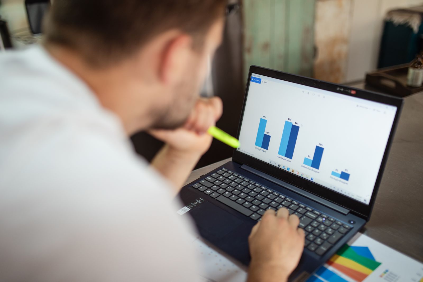 Person reviewing charts on a laptop