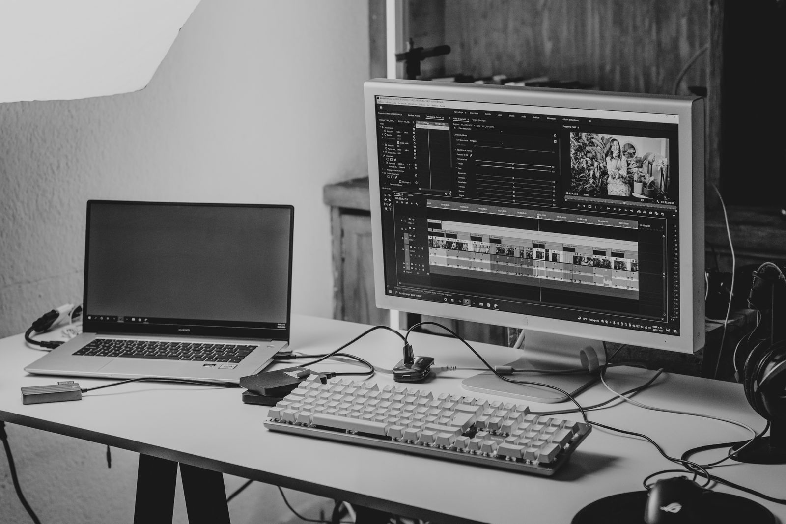 Laptop and monitor with video-editing timelines
