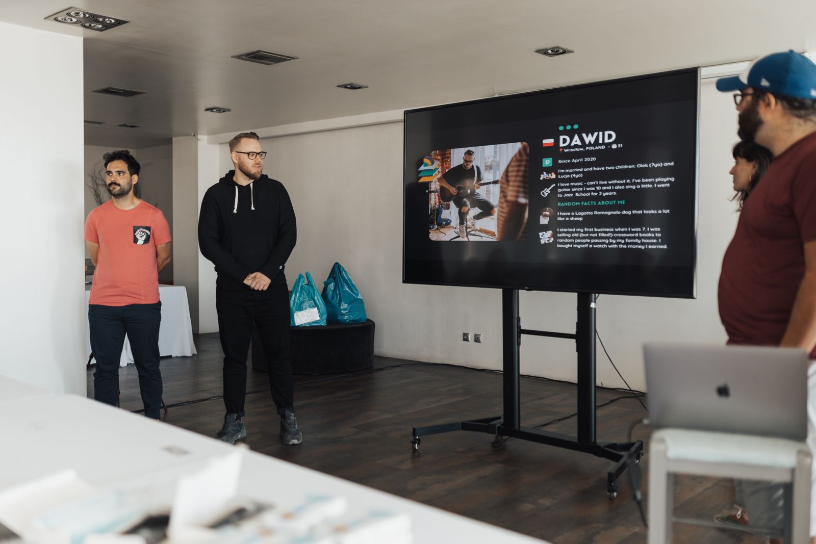 Presenter and colleagues discussing a presentation
