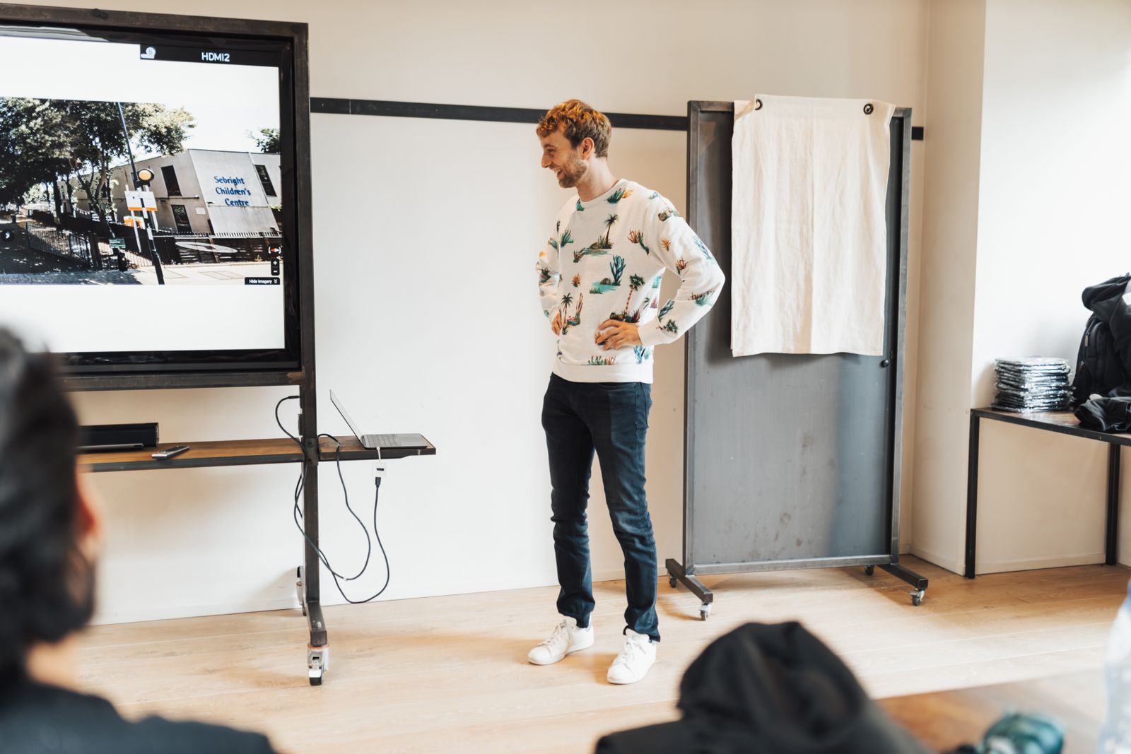 Presenter explaining material to an office audience