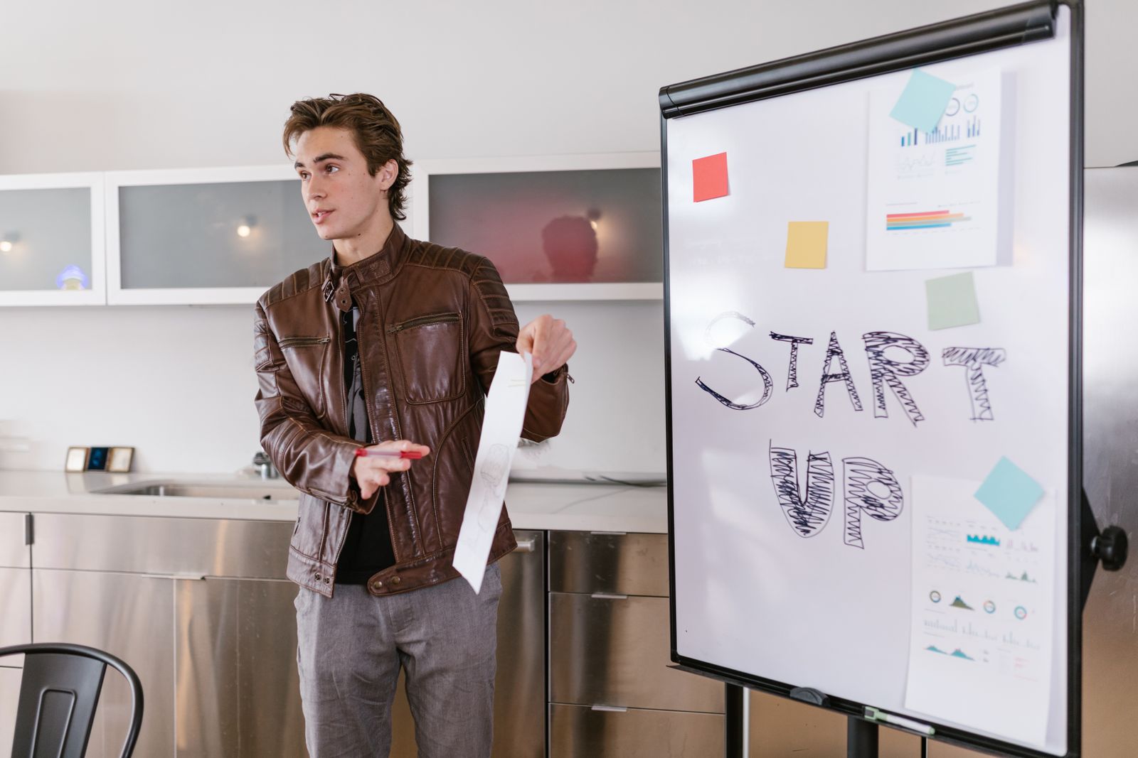 Startup founder presenting fundraising metrics to prospective investors