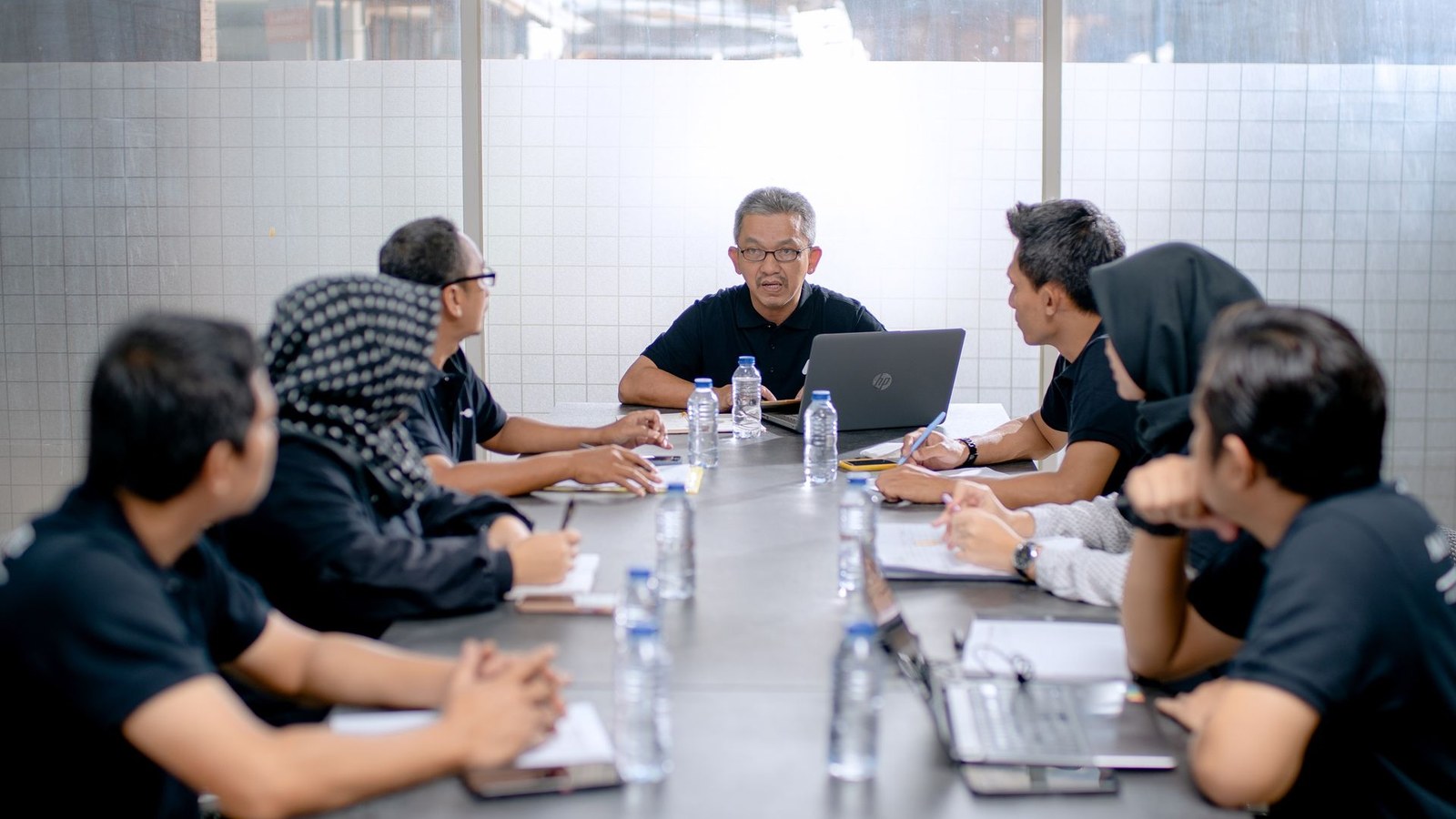 Fundraising team discussing financial and investor materials