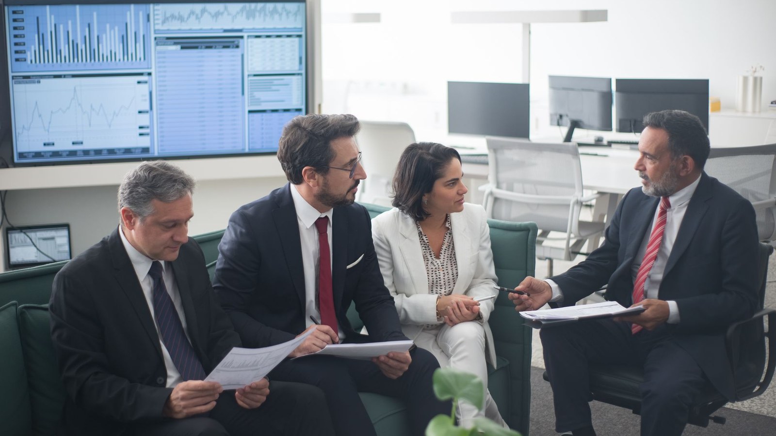 Investment banking team coordinating a transaction data room