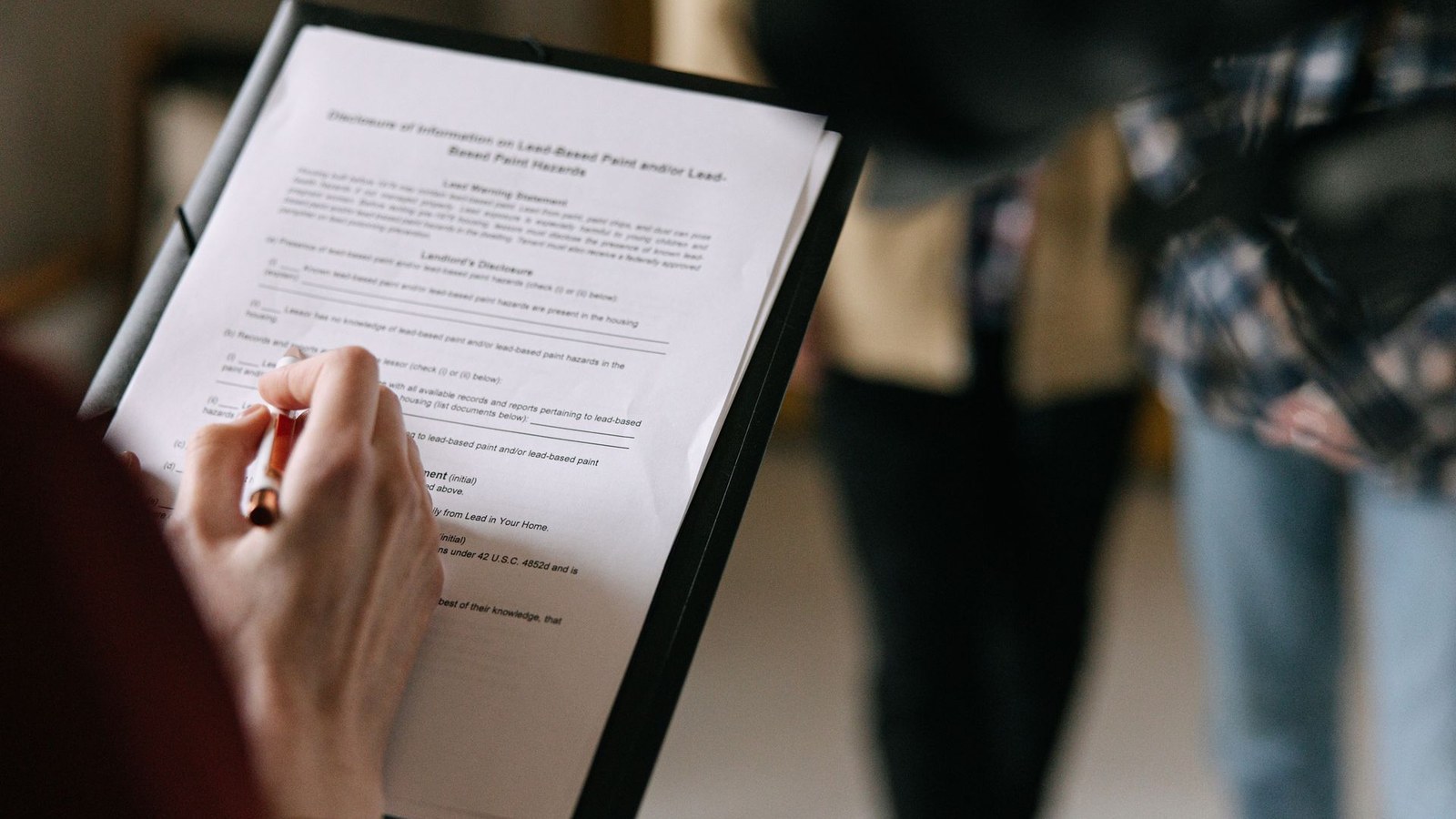Property professional reviewing commercial real estate transaction documents